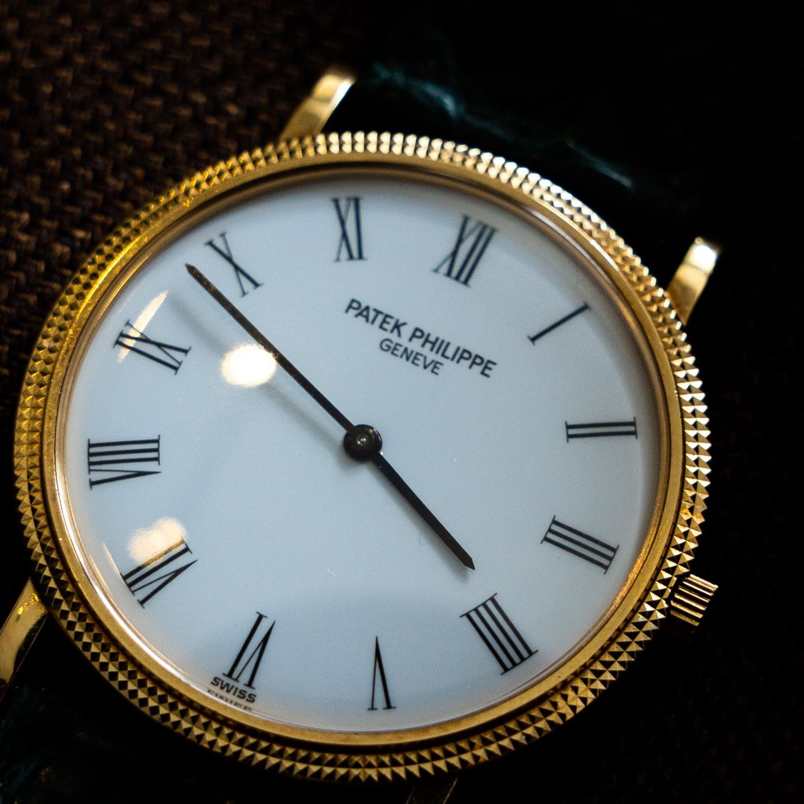 Close-up of the white, roman numerals dial of the Patek Philippe Calatrava 3919J