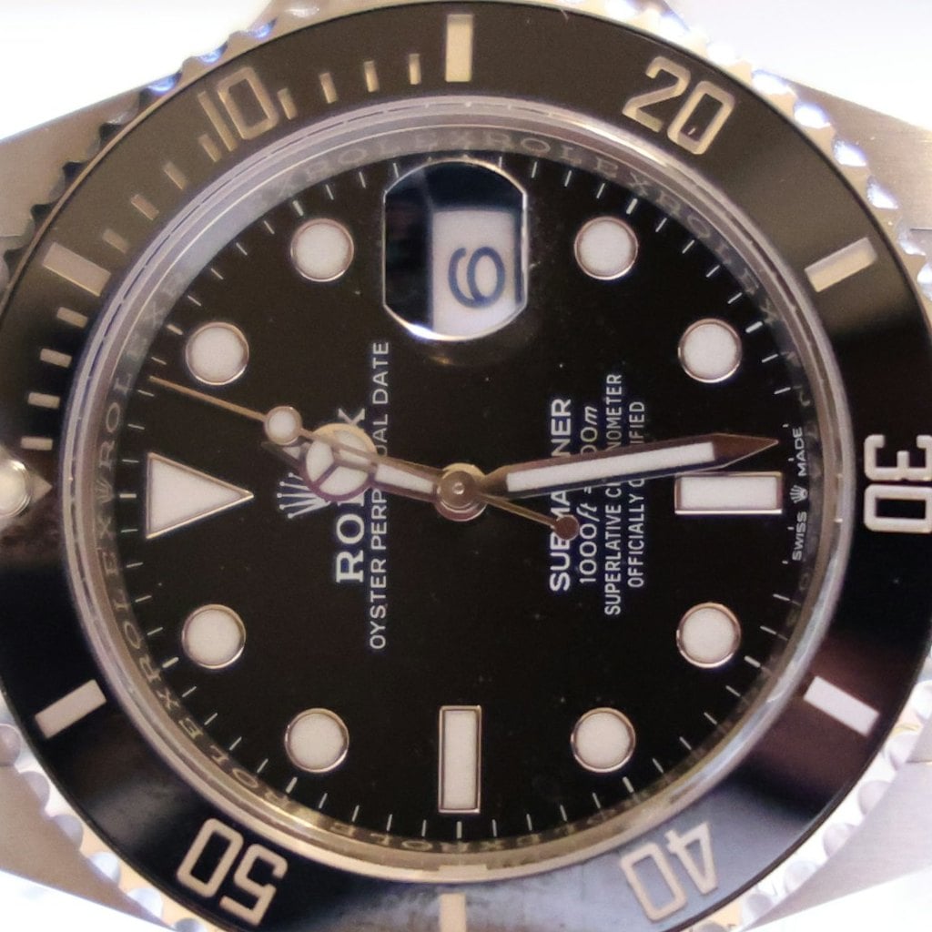 Close-up of the black dial of the Rolex Submariner Date 126610LN