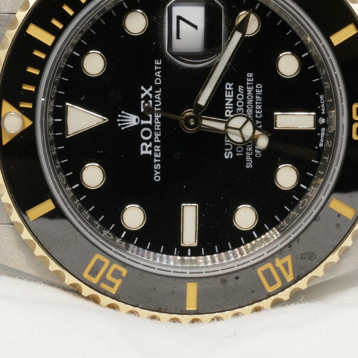 Close-up of the black dial of the Rolex Submariner Date 126613LN