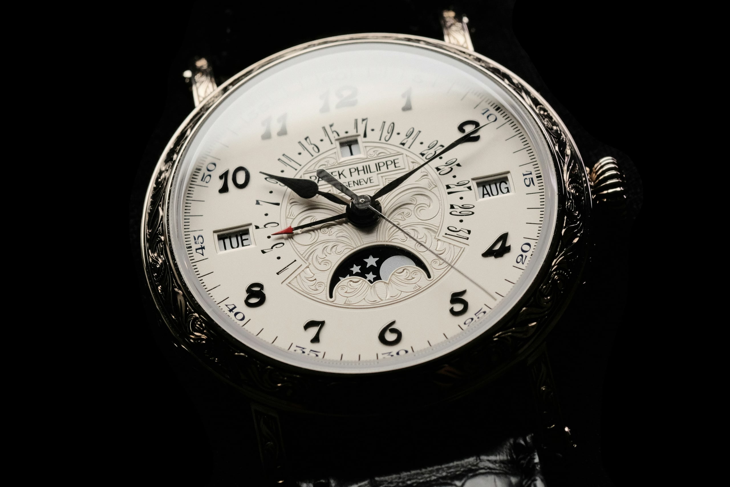 Patek Philippe 5160 perpetual calendar with engraved white-gold case, moon phase and Breguet numerals
