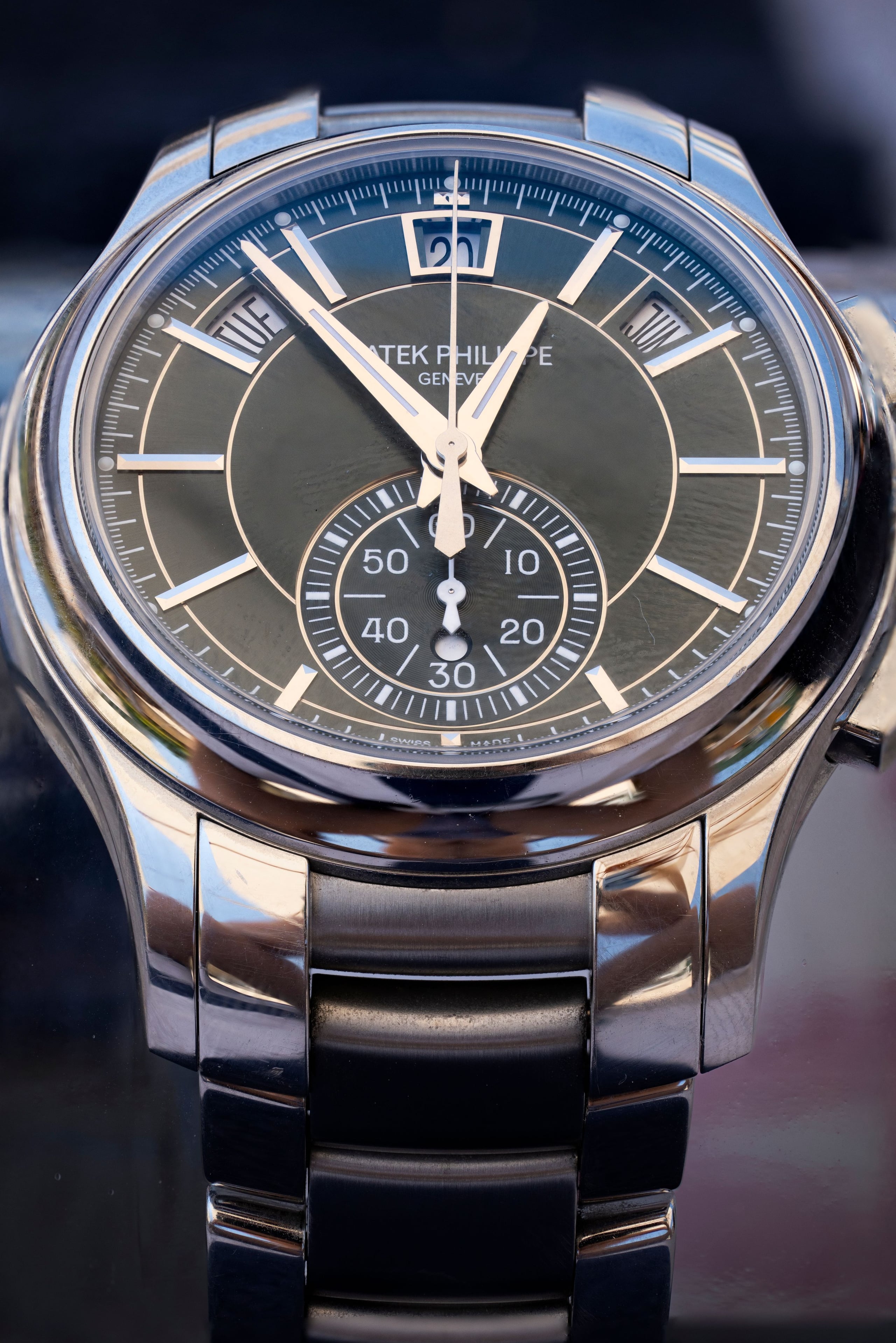 Patek Philippe 5905/1A annual calendar chronograph with green sunburst dial on a steel bracelet